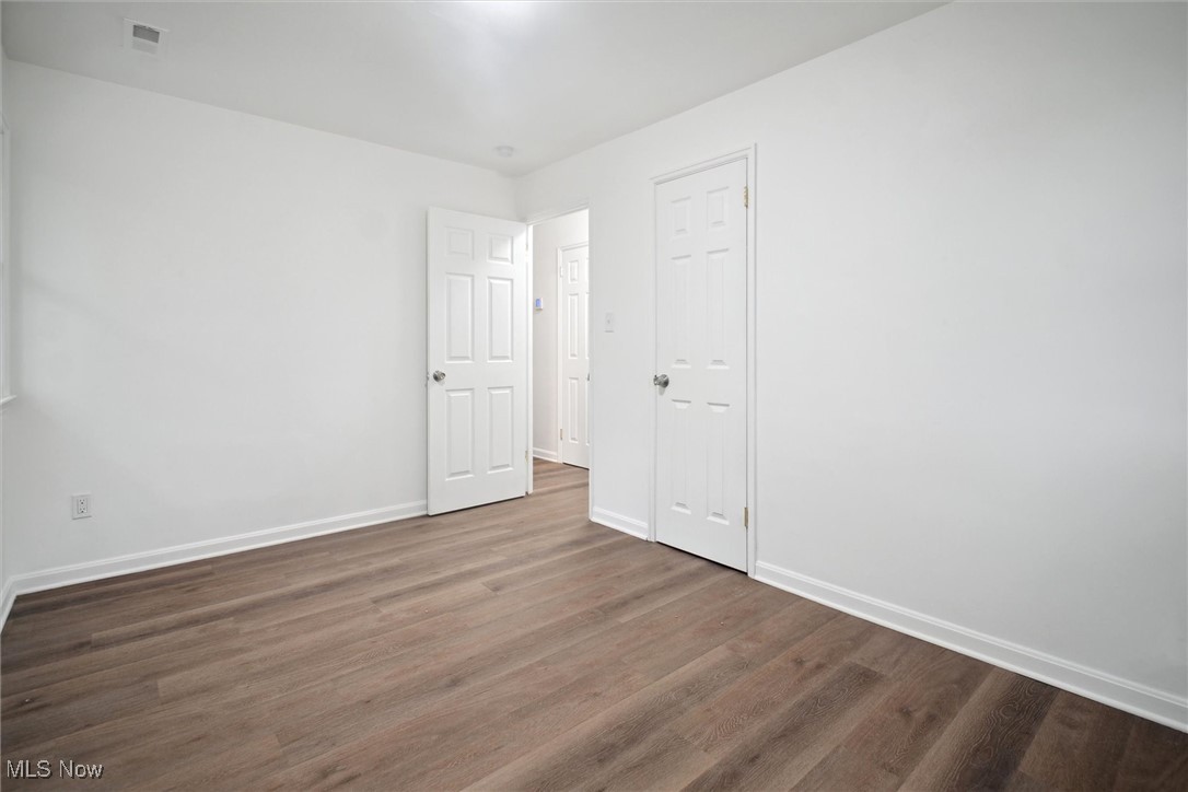 8796 West Ridgewood Drive Cleveland, OH 44130 - Photo 27 of 38 Unfurnished room with hardwood / wood-style flooring