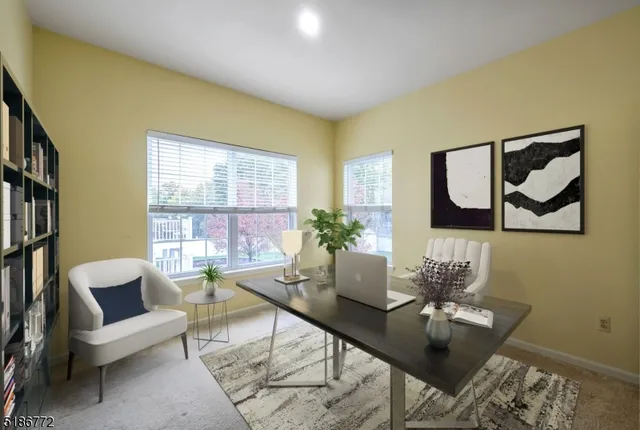 a workspace with furniture and window