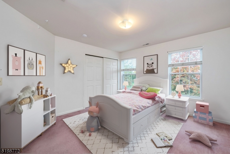 89 Hill Hollow Road Lake Hopatcong, NJ 07849 - Photo 16 of 25 a bedroom with a bed and wooden floor