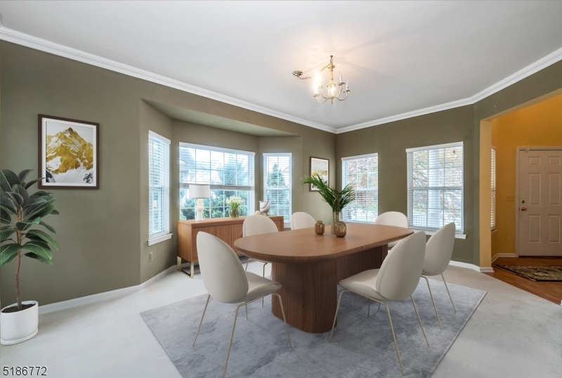 89 Hill Hollow Road Lake Hopatcong, NJ 07849 - Photo 5 of 25 a view of a dining room with furniture window and outside view