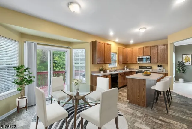 a view of a dining room with furniture window and outside view
