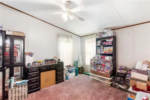 a view of a workspace with furniture and toys