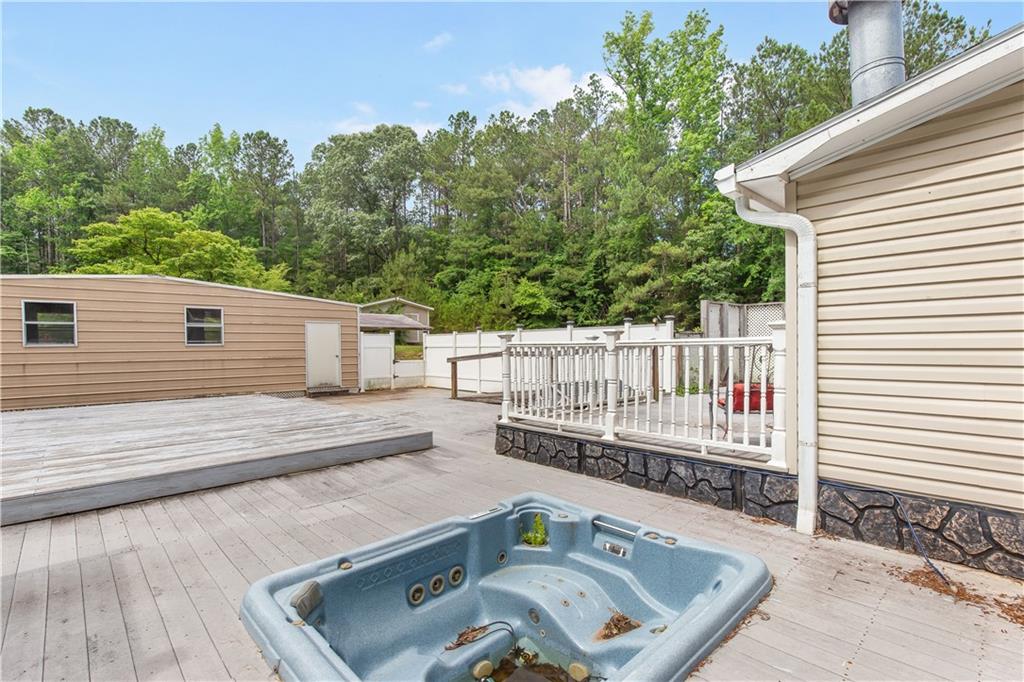 294 Birch Road Franklin, GA 30217 - Photo 22 of 30 a view of a roof deck with wooden fence