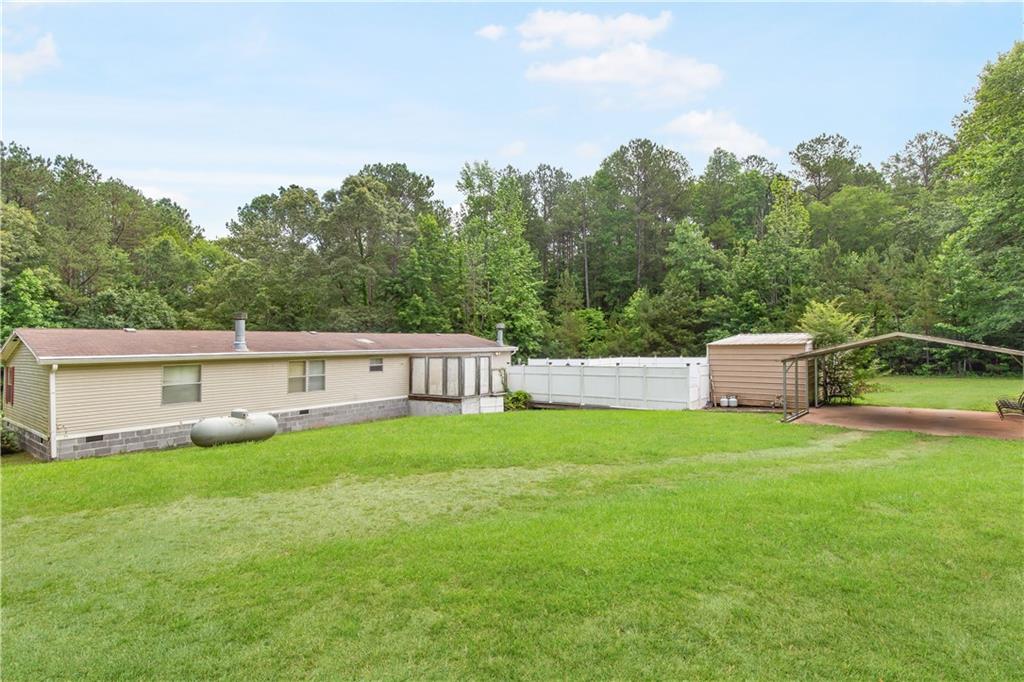 294 Birch Road Franklin, GA 30217 - Photo 25 of 30 a house with garden in front of it