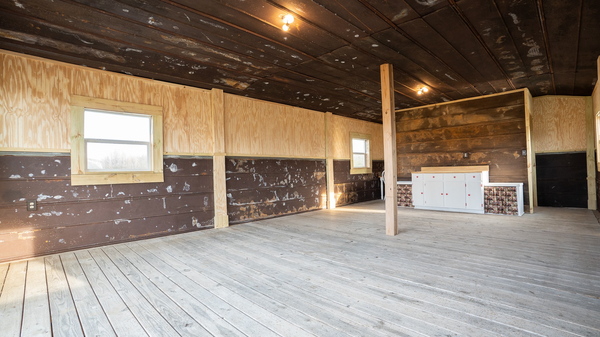 107 Echols Road Elora, TN 37328 - Photo 43 of 50 a view of empty room with wooden floor and windows