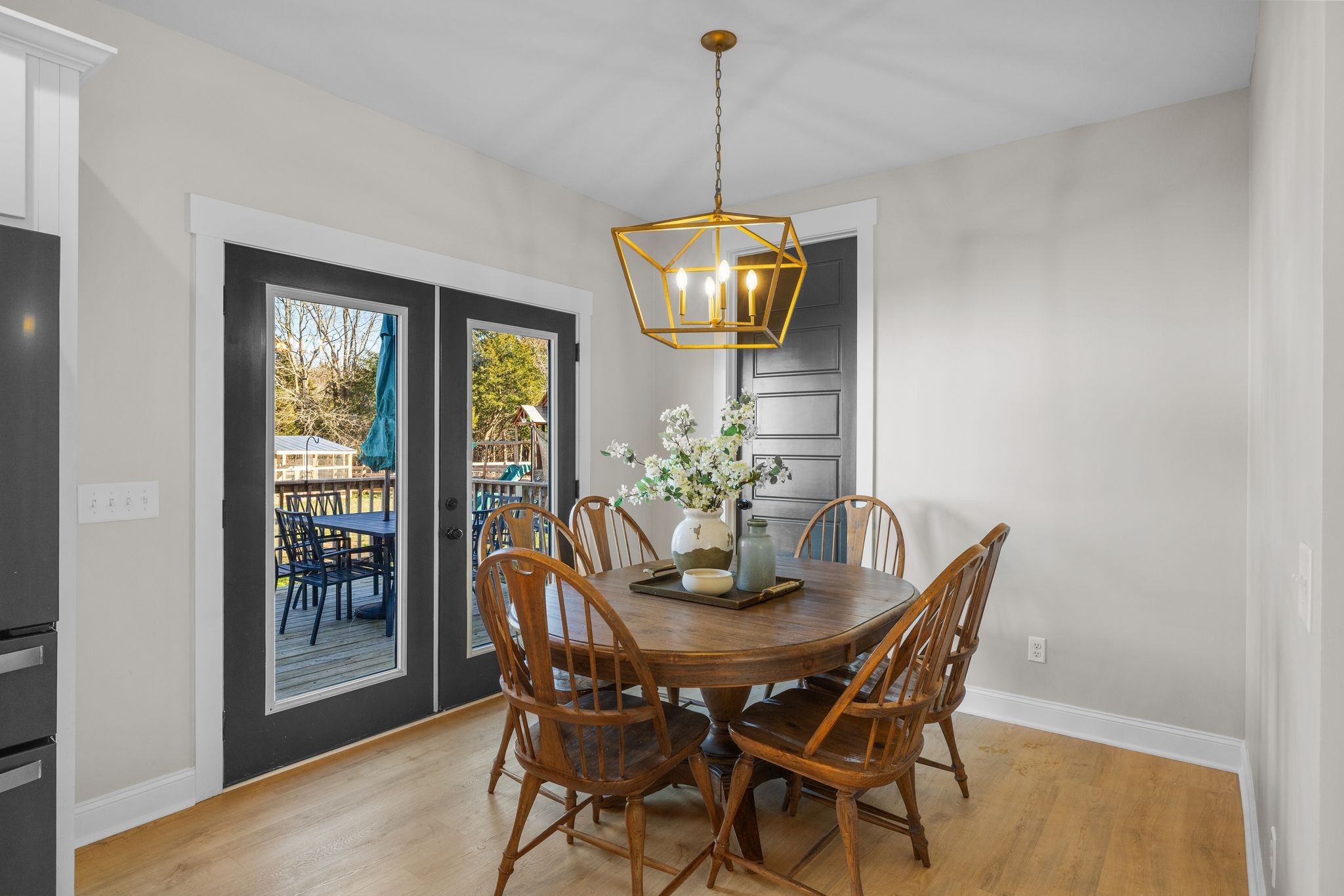 1677 Mc Bride Road Lewisburg, TN 37091 - Photo 13 of 35 a dining room with furniture a chandelier and wooden floor