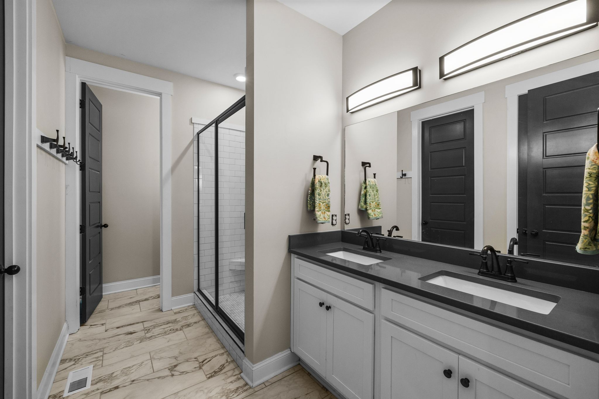1677 Mc Bride Road Lewisburg, TN 37091 - Photo 18 of 35 a bathroom with a double vanity sink and a mirror