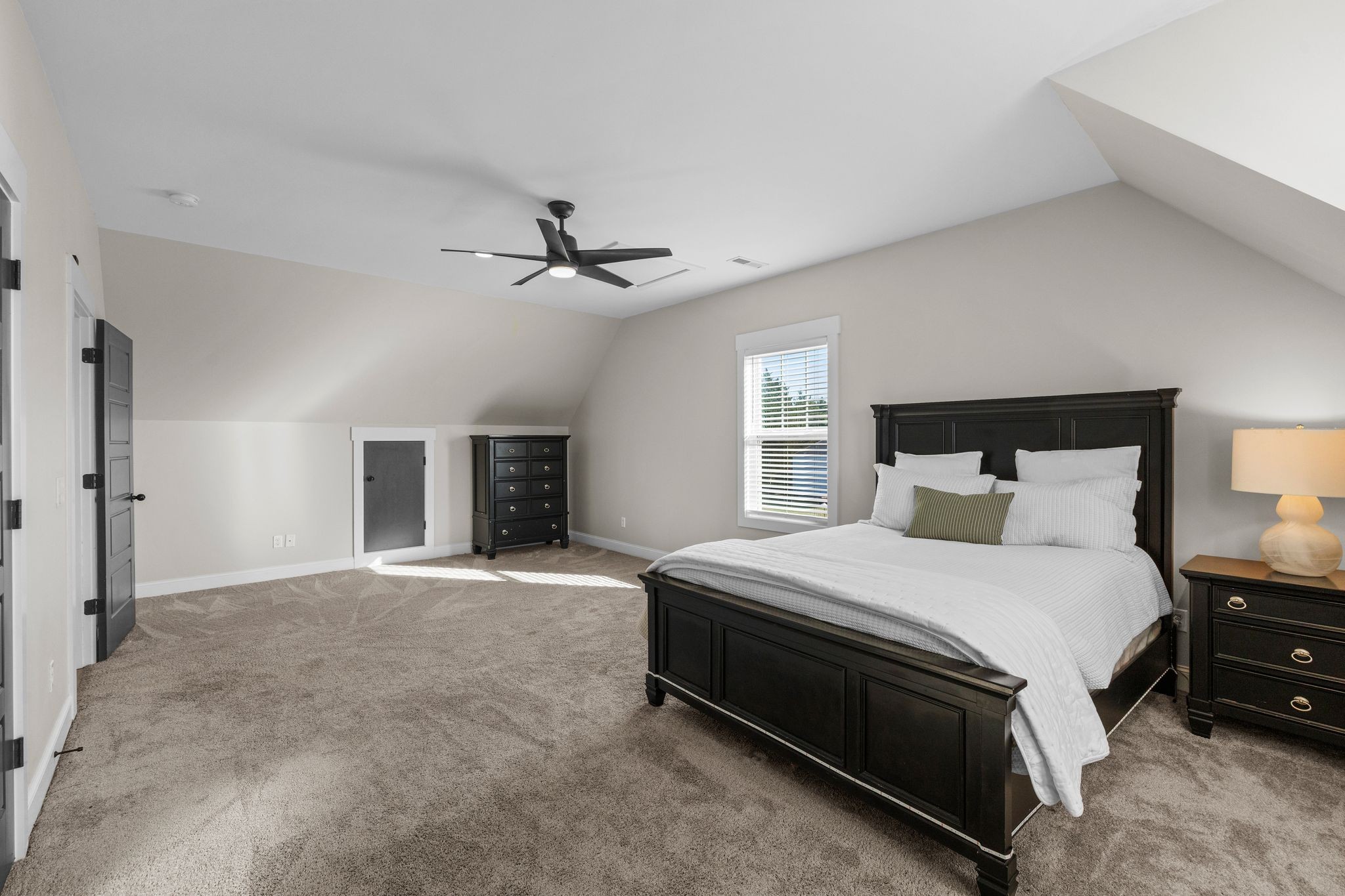 1677 Mc Bride Road Lewisburg, TN 37091 - Photo 24 of 35 a spacious bedroom with a bed and a ceiling fan