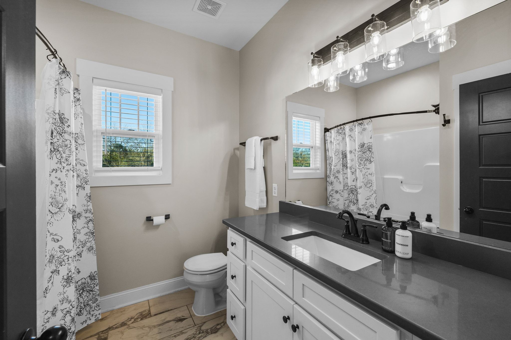 1677 Mc Bride Road Lewisburg, TN 37091 - Photo 25 of 35 a bathroom with a granite countertop sink toilet and shower