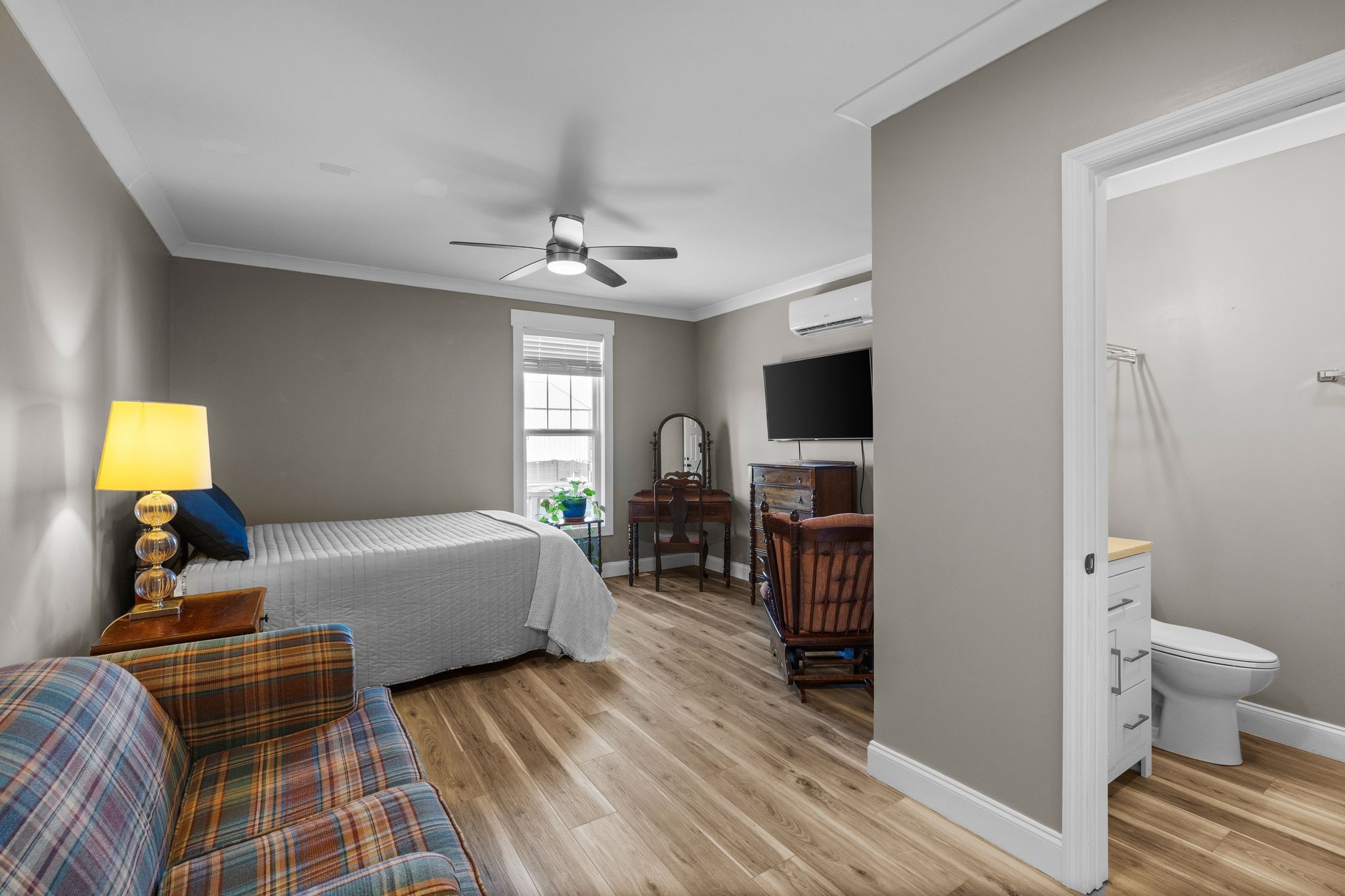 1677 Mc Bride Road Lewisburg, TN 37091 - Photo 28 of 35 a bedroom with a bed and wooden floor