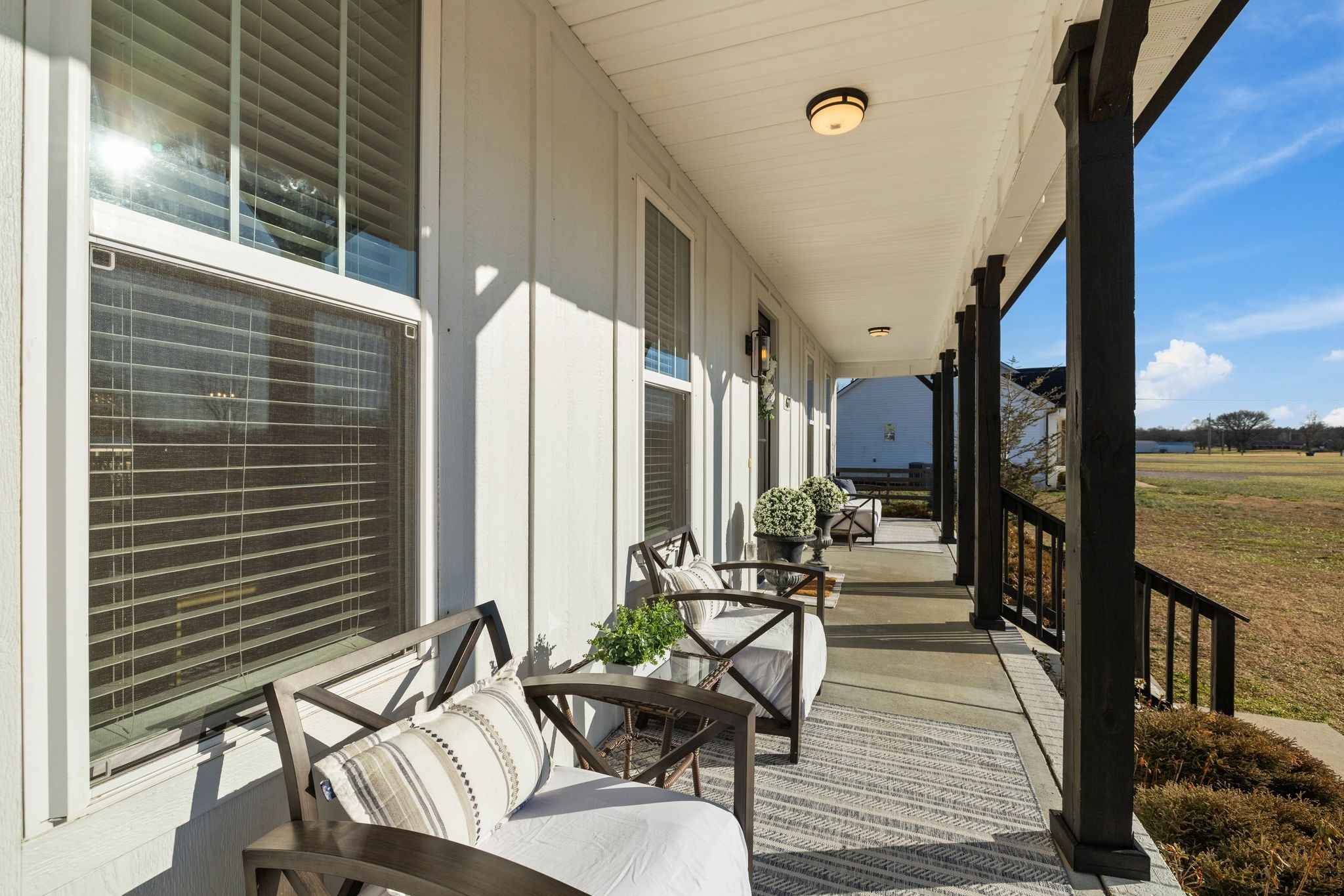 1677 Mc Bride Road Lewisburg, TN 37091 - Photo 5 of 35 a balcony with chairs and wooden floor