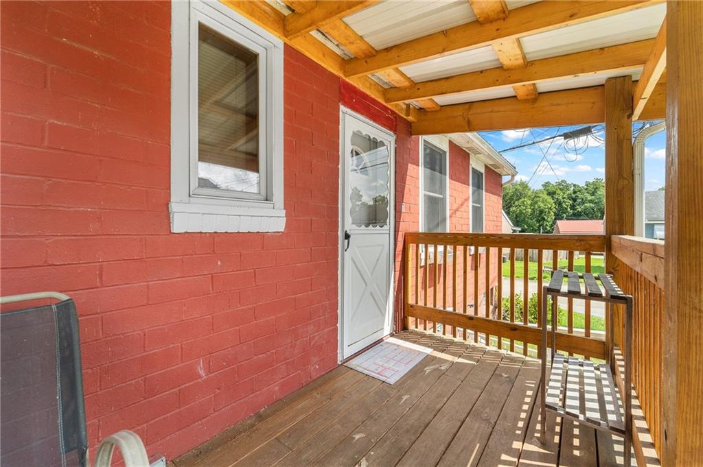 7 A Street Clarksville, PA 15322 - Photo 3 of 27 a view of a balcony with wooden floor