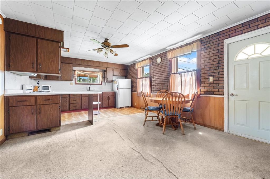 7 A Street Clarksville, PA 15322 - Photo 7 of 27 a dining room with a wooden table and chairs