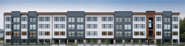 a front view of a large building with a lot of windows