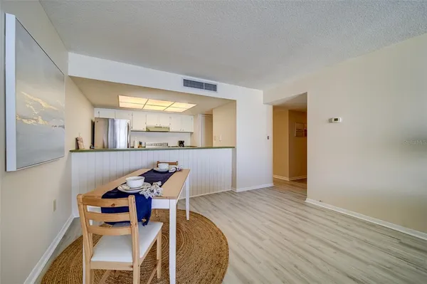 a view of a kitchen and dining room