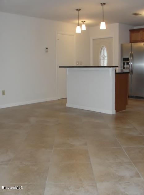 914 Cherokee Road Southeast Palm Bay, FL 32909 - Photo 12 of 36 Living room to kitchen View