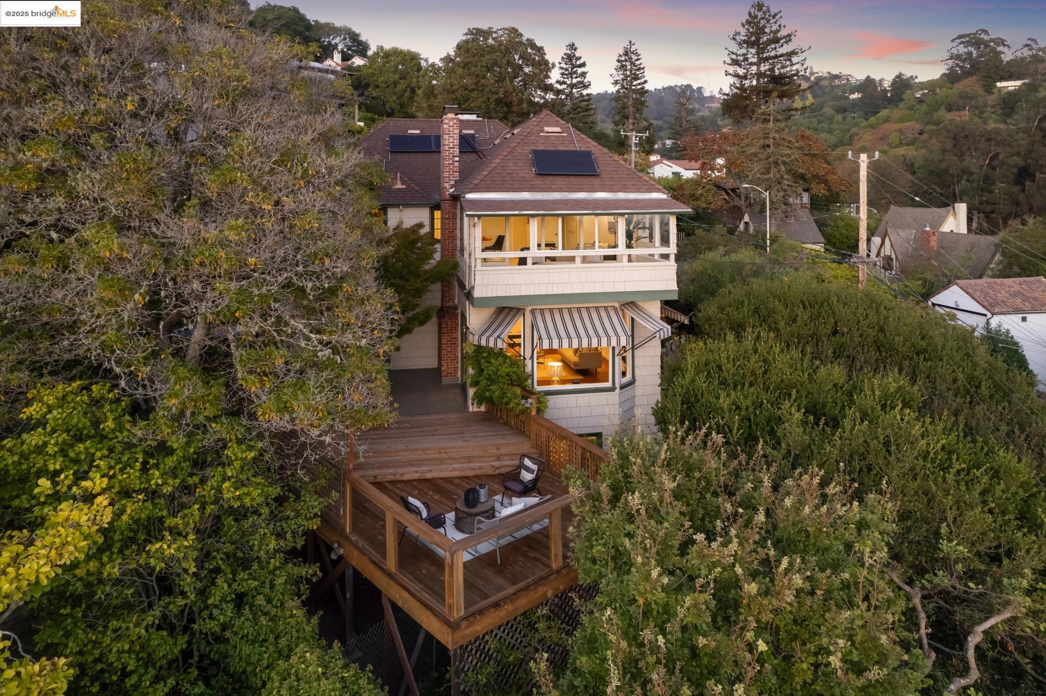 a balcony with tall trees