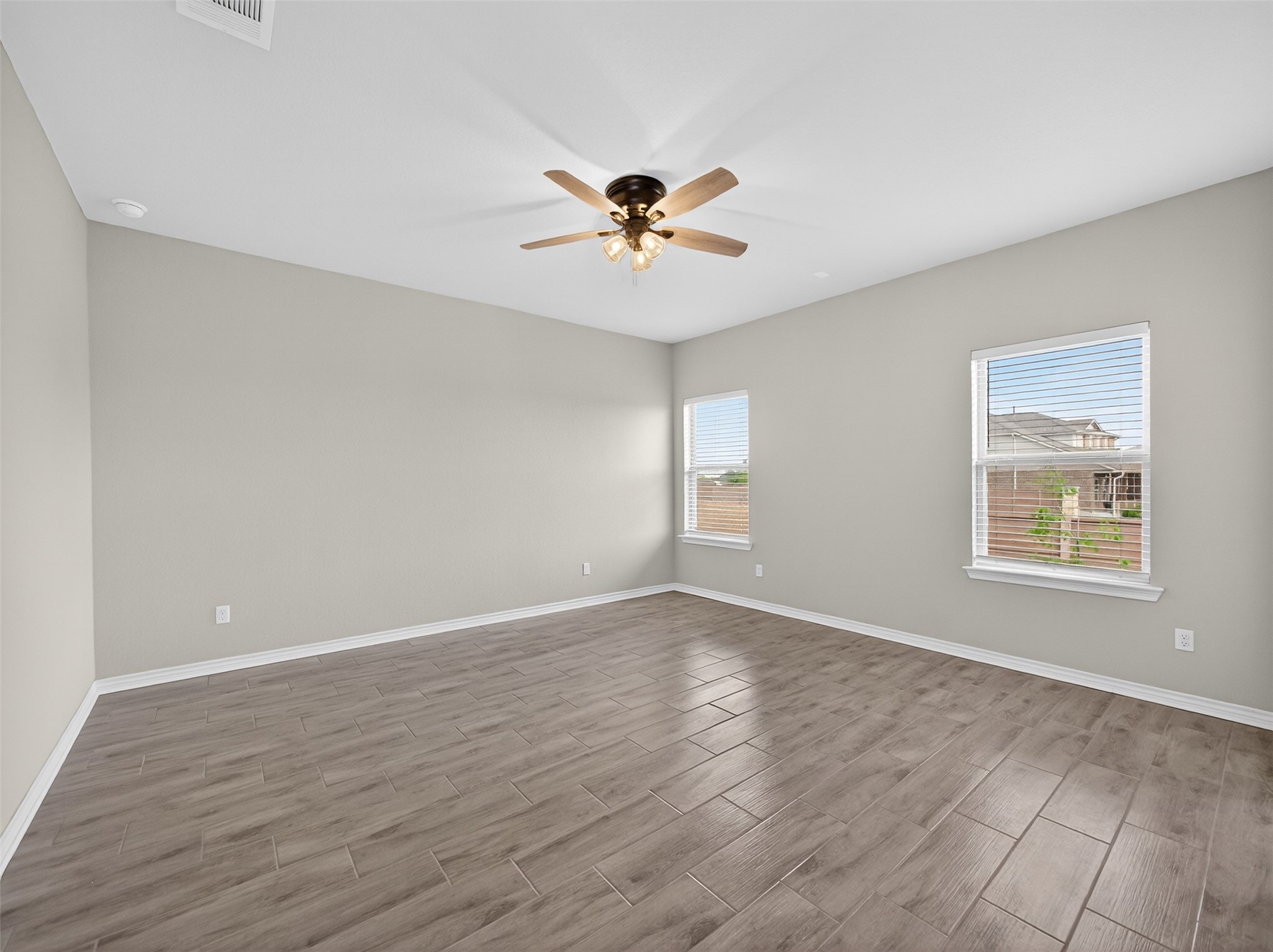 521 Rearing Mare Pass Georgetown, TX 78626 - Photo 13 of 39 wooden floor in an empty room with a window