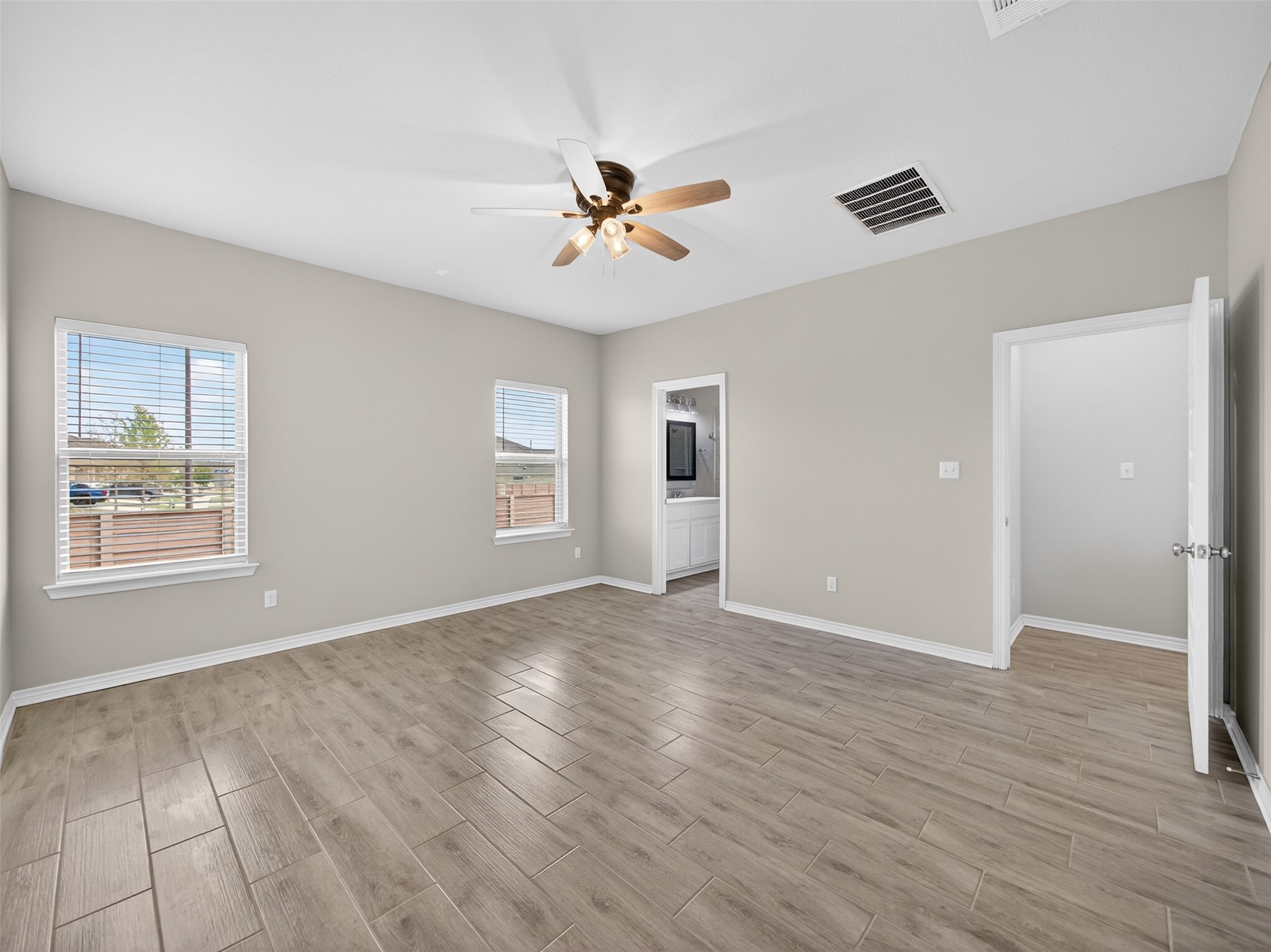521 Rearing Mare Pass Georgetown, TX 78626 - Photo 14 of 39 wooden floor in an empty room with a window
