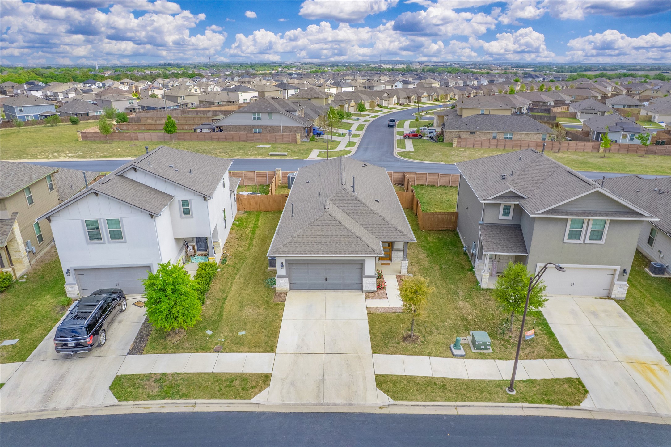 521 Rearing Mare Pass Georgetown, TX 78626 - Photo 2 of 39 an aerial view of a house with a garden and lake view