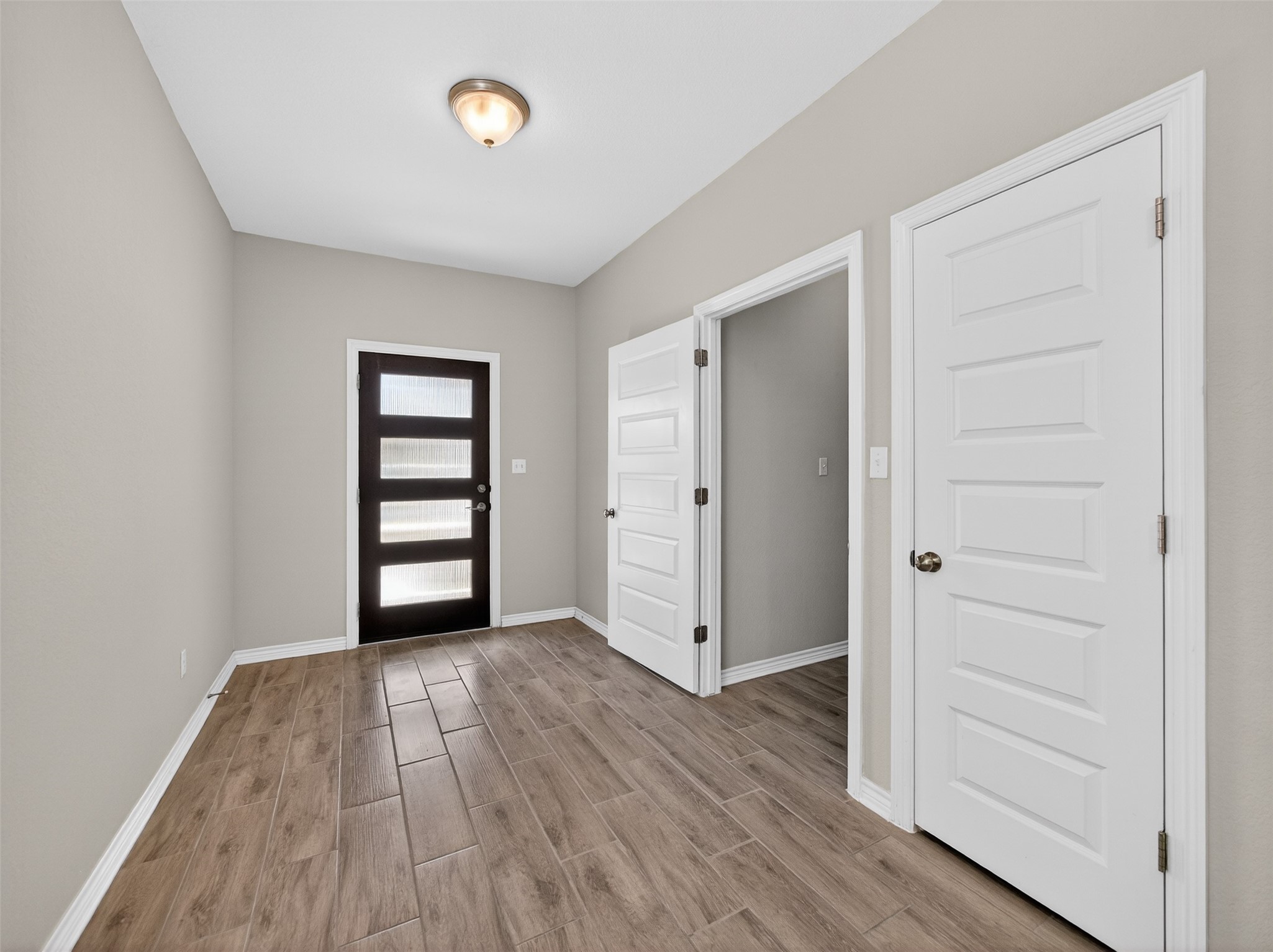 521 Rearing Mare Pass Georgetown, TX 78626 - Photo 3 of 39 wooden floor in an empty room