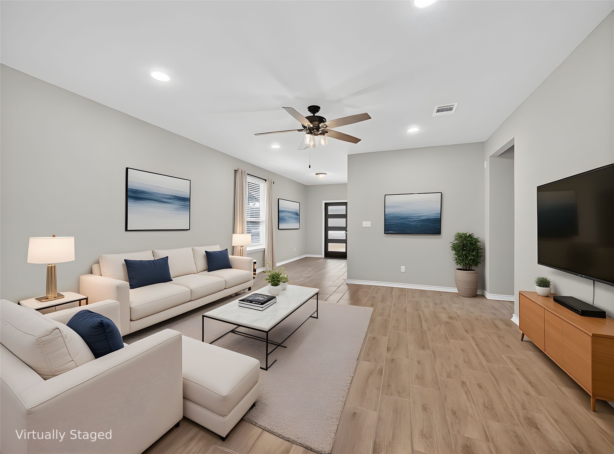 521 Rearing Mare Pass Georgetown, TX 78626 - Photo 4 of 39 a living room with furniture and a flat screen tv