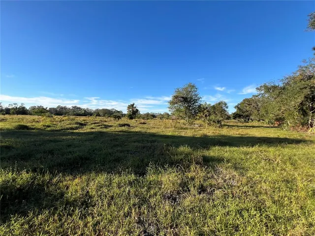 a view of lake with green space
