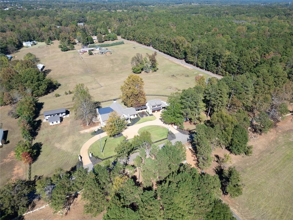 419 Parker Road McDonough, GA 30252 - Photo 101 of 103 an aerial view of a house with a yard and trees all around
