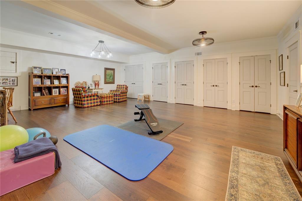 419 Parker Road McDonough, GA 30252 - Photo 75 of 103 a room with furniture gym equipment and view of living room