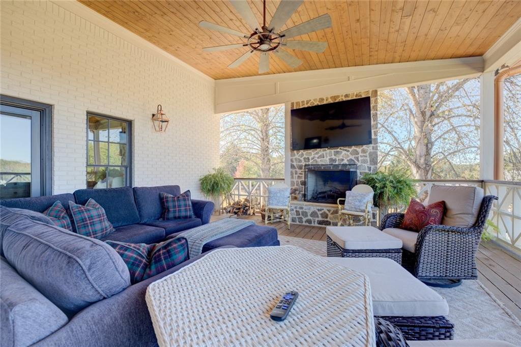419 Parker Road McDonough, GA 30252 - Photo 83 of 103 a living room with furniture a fireplace and a flat screen tv