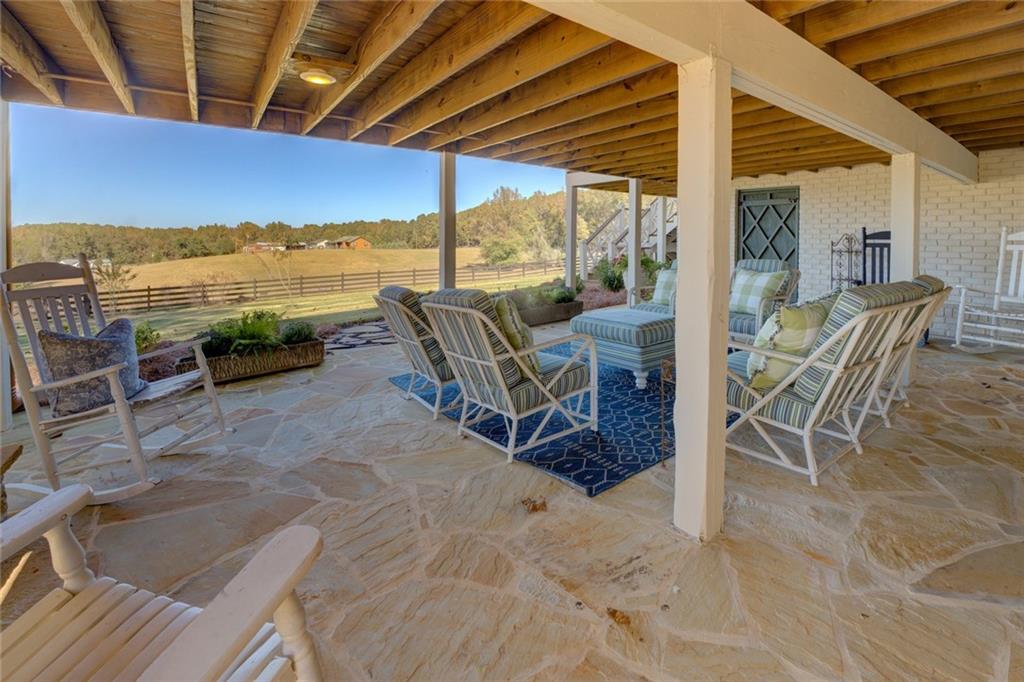 419 Parker Road McDonough, GA 30252 - Photo 88 of 103 a view of a patio with a table and chairs next to a yard