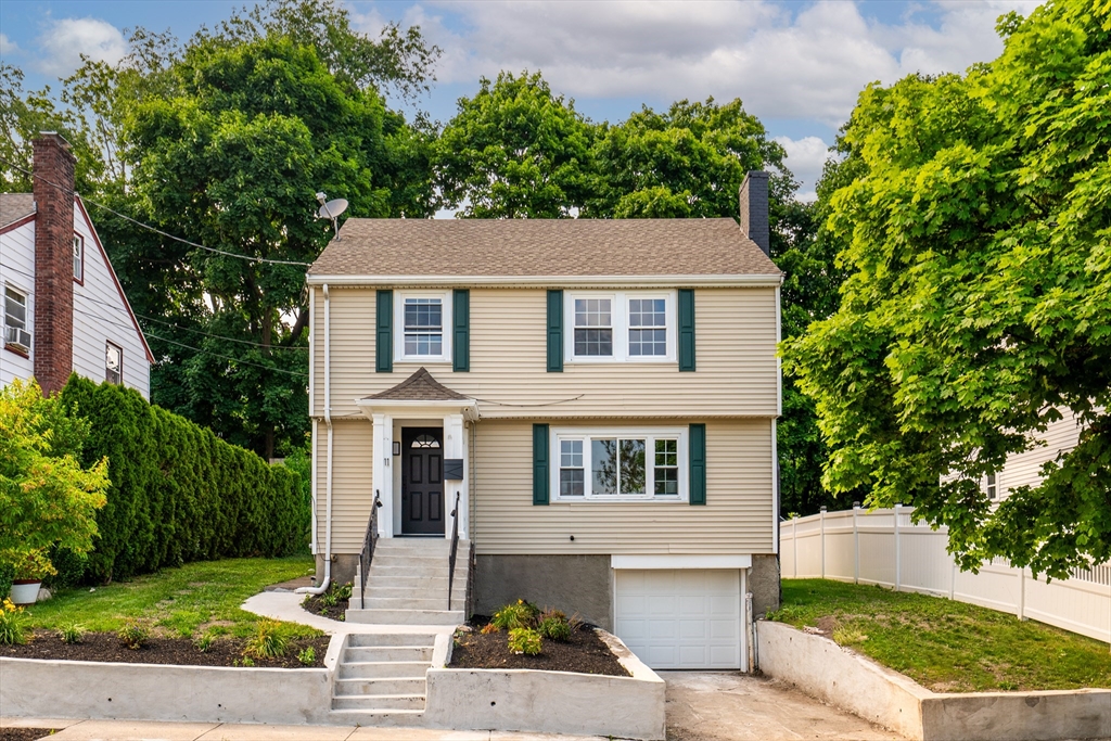 11 Clancy Road Boston, MA 02124 - Photo 1 of 19 a front view of a house with garden