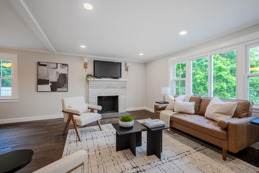 11 Clancy Road Boston, MA 02124 - Photo 3 of 19 a living room with furniture a fireplace and a large window