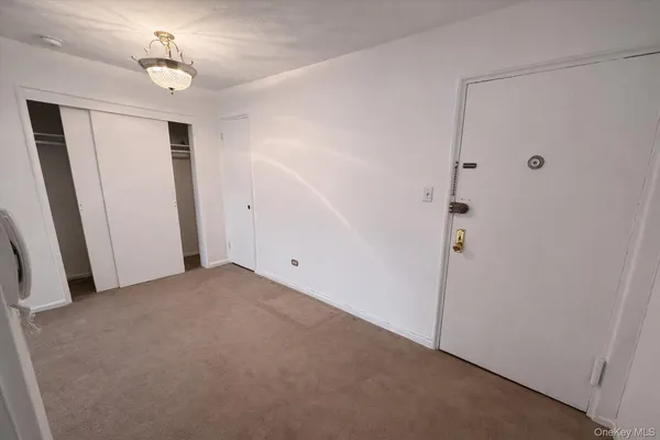 a view of a livingroom with furniture and window