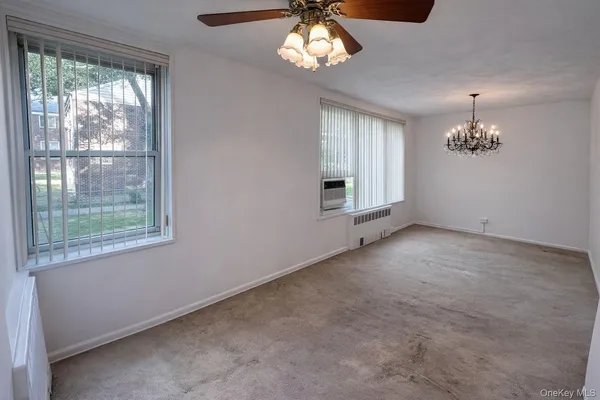a view of room with ceiling fan