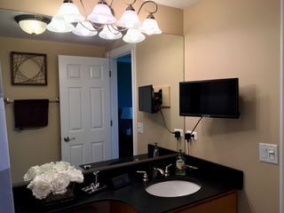 1 Renaissance Place, Unit 1100 Palatine, IL 60067 - Photo 15 of 28 a bathroom with a sink mirror and vanity