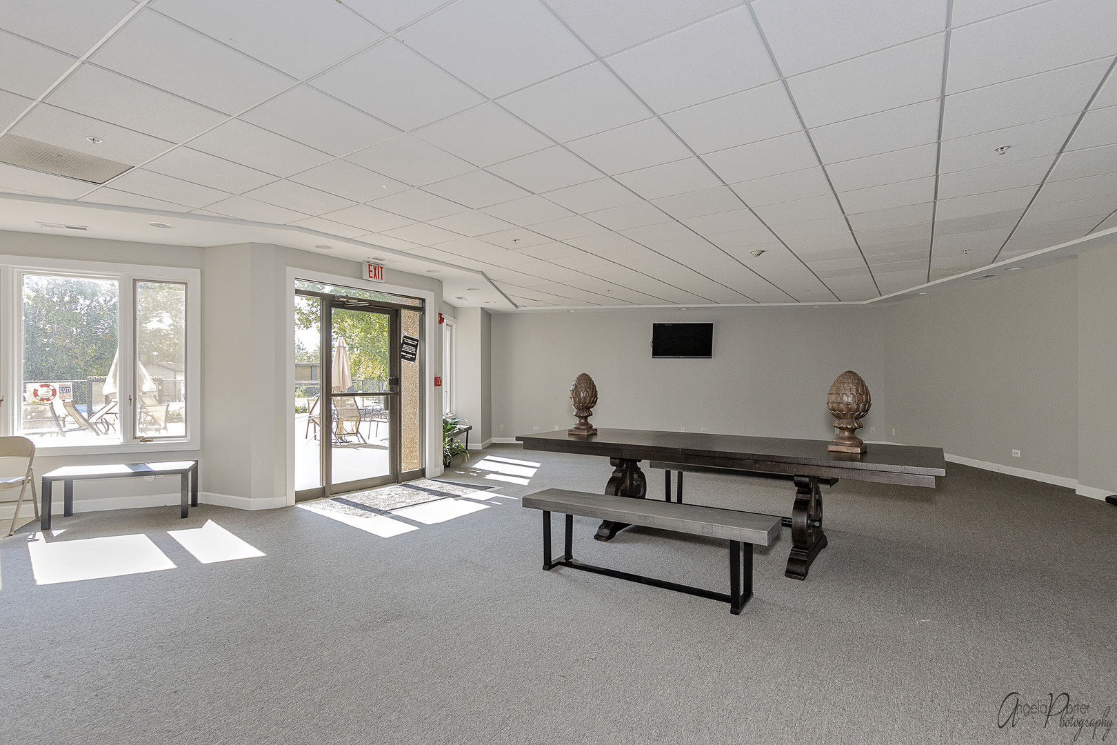 1 Renaissance Place, Unit 1100 Palatine, IL 60067 - Photo 26 of 28 a living room with furniture gym equipment and a large window