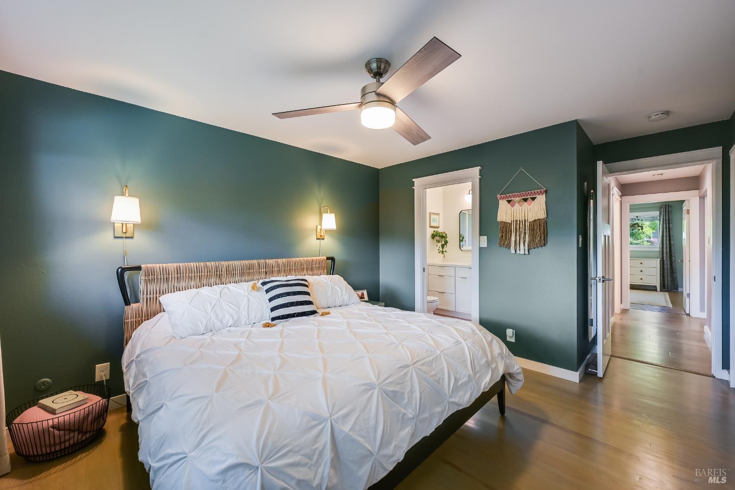 2009 Hidden Valley Drive Santa Rosa, CA 95404 - Photo 12 of 26 a bedroom with a large bed and a chandelier