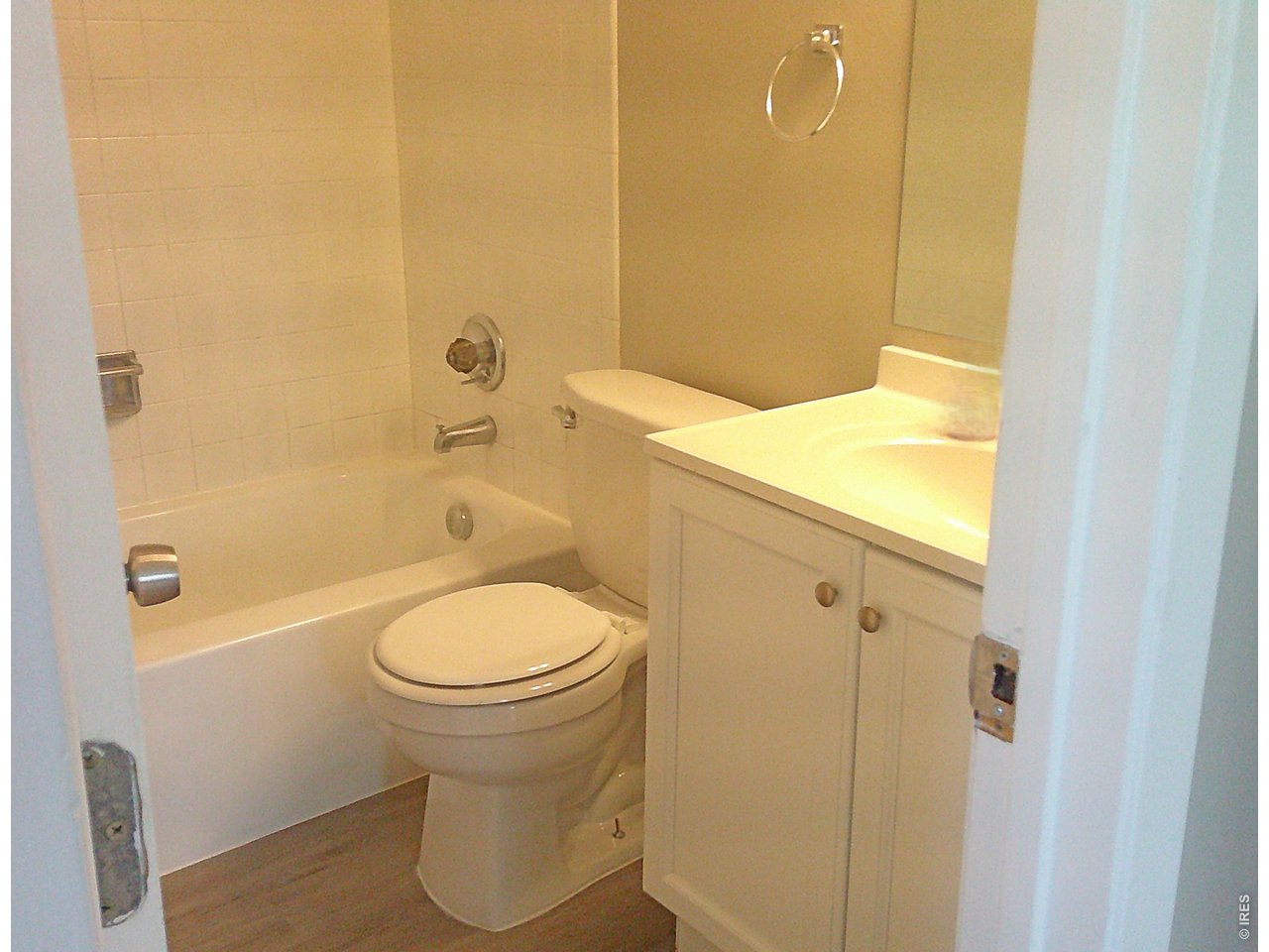 1165 South Oneida Street, Unit E Denver, CO 80224 - Photo 17 of 18 a bathroom with a toilet and a shower