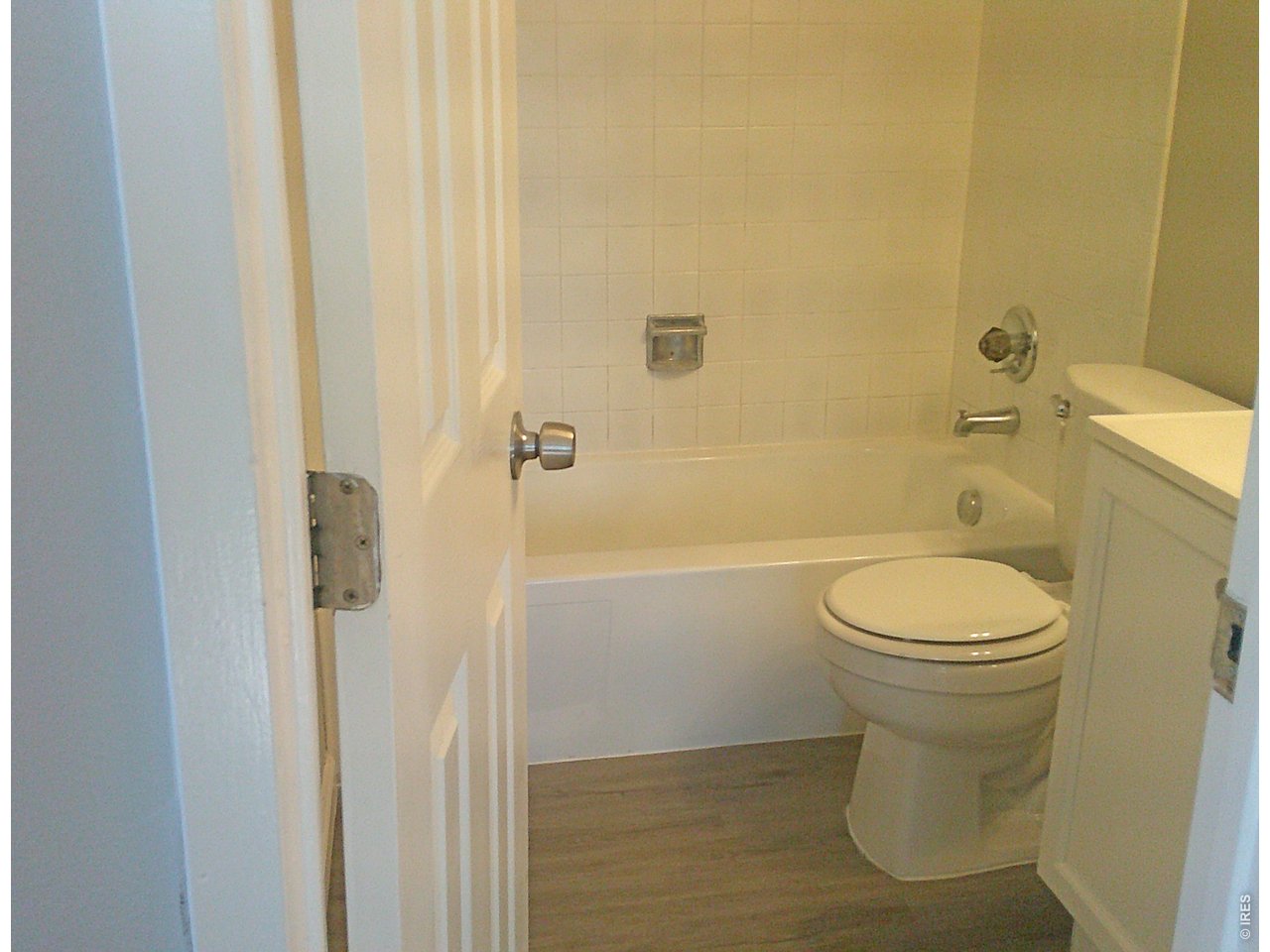 1165 South Oneida Street, Unit E Denver, CO 80224 - Photo 18 of 18 a bathroom with a toilet and a shower