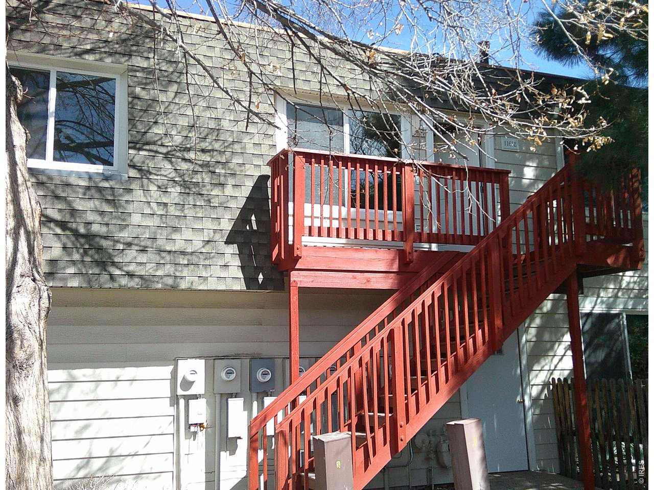 1165 South Oneida Street, Unit E Denver, CO 80224 - Photo 2 of 18 a view of balcony with wooden floor and stairs