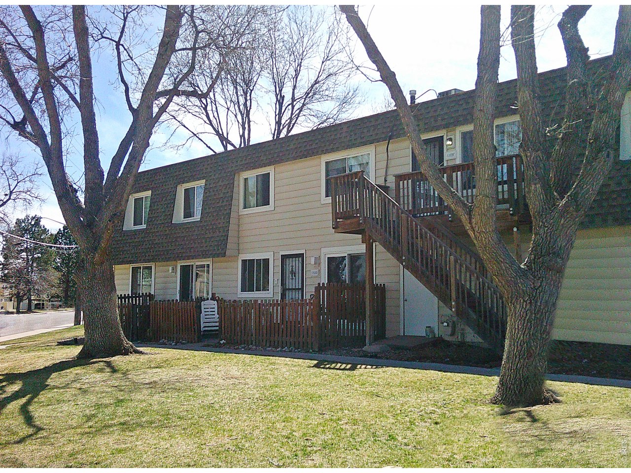1165 South Oneida Street, Unit E Denver, CO 80224 - Photo 5 of 18 a view of a house with a yard