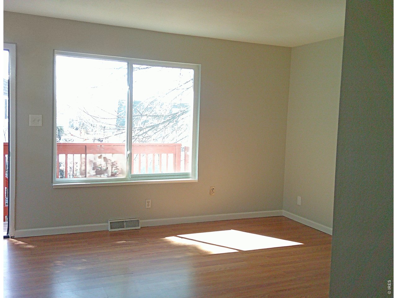 1165 South Oneida Street, Unit E Denver, CO 80224 - Photo 9 of 18 an empty room with a window