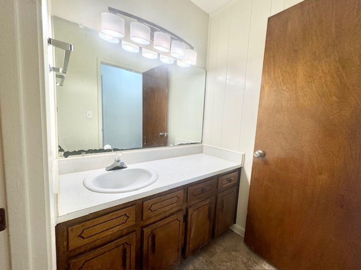 135 Perdido Circle Niceville, FL 32578 - Photo 17 of 22 a bathroom with a sink and a mirror