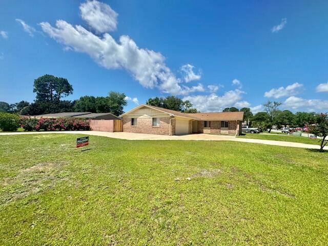 135 Perdido Circle Niceville, FL 32578 - Photo 2 of 22 a front view of a house with a big yard