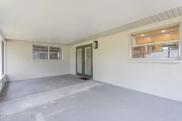 an aerial view of a house with swimming pool