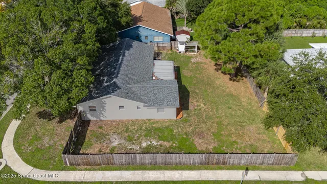 a view of a backyard with a small cabin