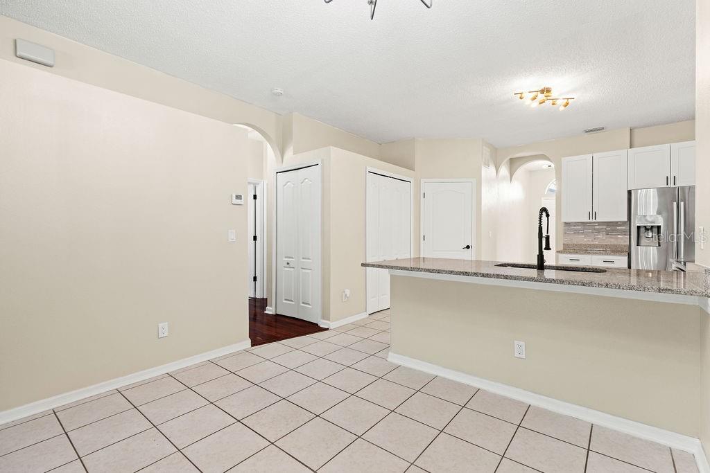 10641 Firebrick Court Trinity, FL 34655 - Photo 12 of 47 a view of a kitchen with white cabinets