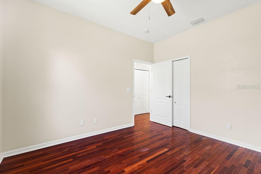 10641 Firebrick Court Trinity, FL 34655 - Photo 14 of 47 wooden floor in an empty room