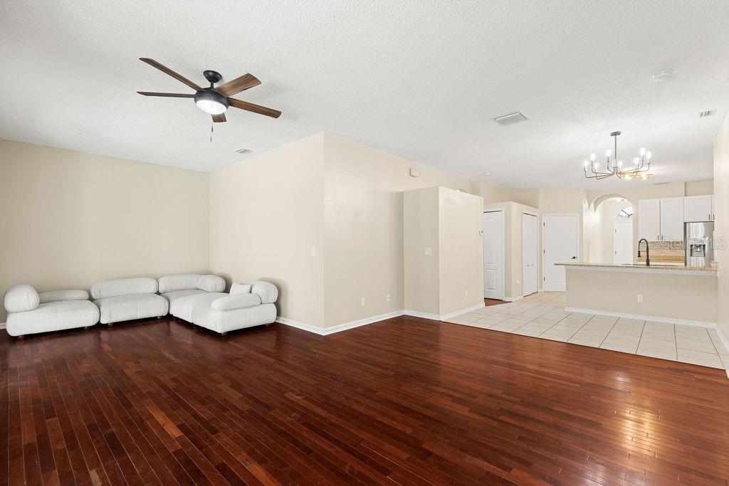 10641 Firebrick Court Trinity, FL 34655 - Photo 24 of 47 a view of livingroom and dining room with wooden floor